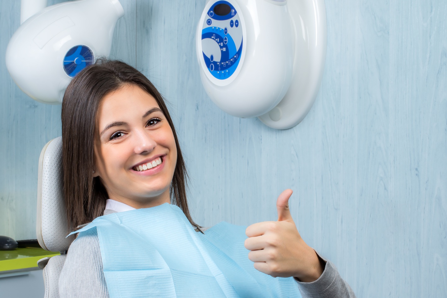 A dental patient doing thumbs up in Westbank Dental Care & Implant Centre West Kelowna